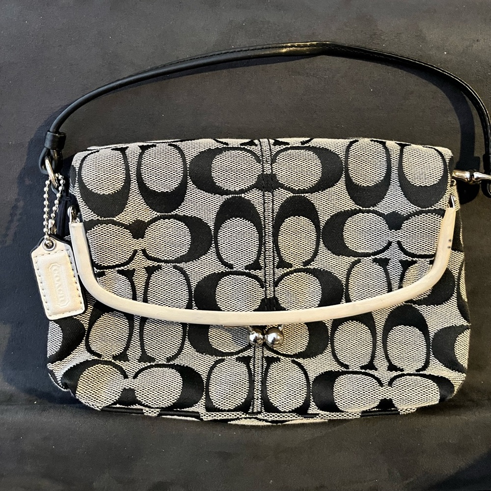 Coach Y2K vintage Signature Canvas Fold Over Frame Bag with a kisslock closure